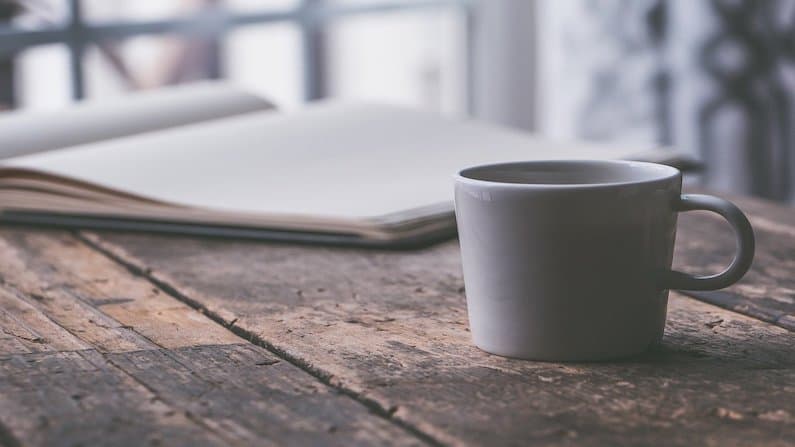 coffee cup and Coronavirus journal